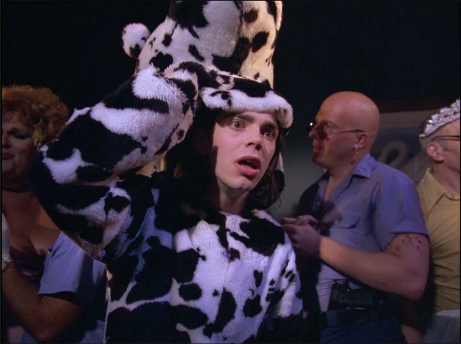 Tromeo in a cow outfit checking out Juliet off screen