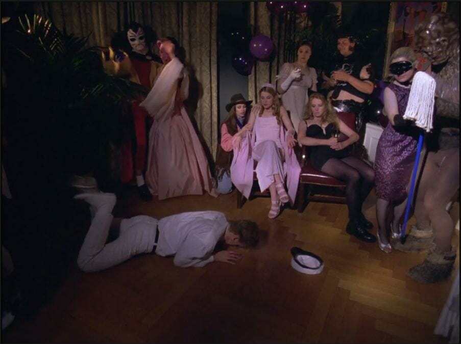 Characters sitting and dancing at a party with one person on the floor.